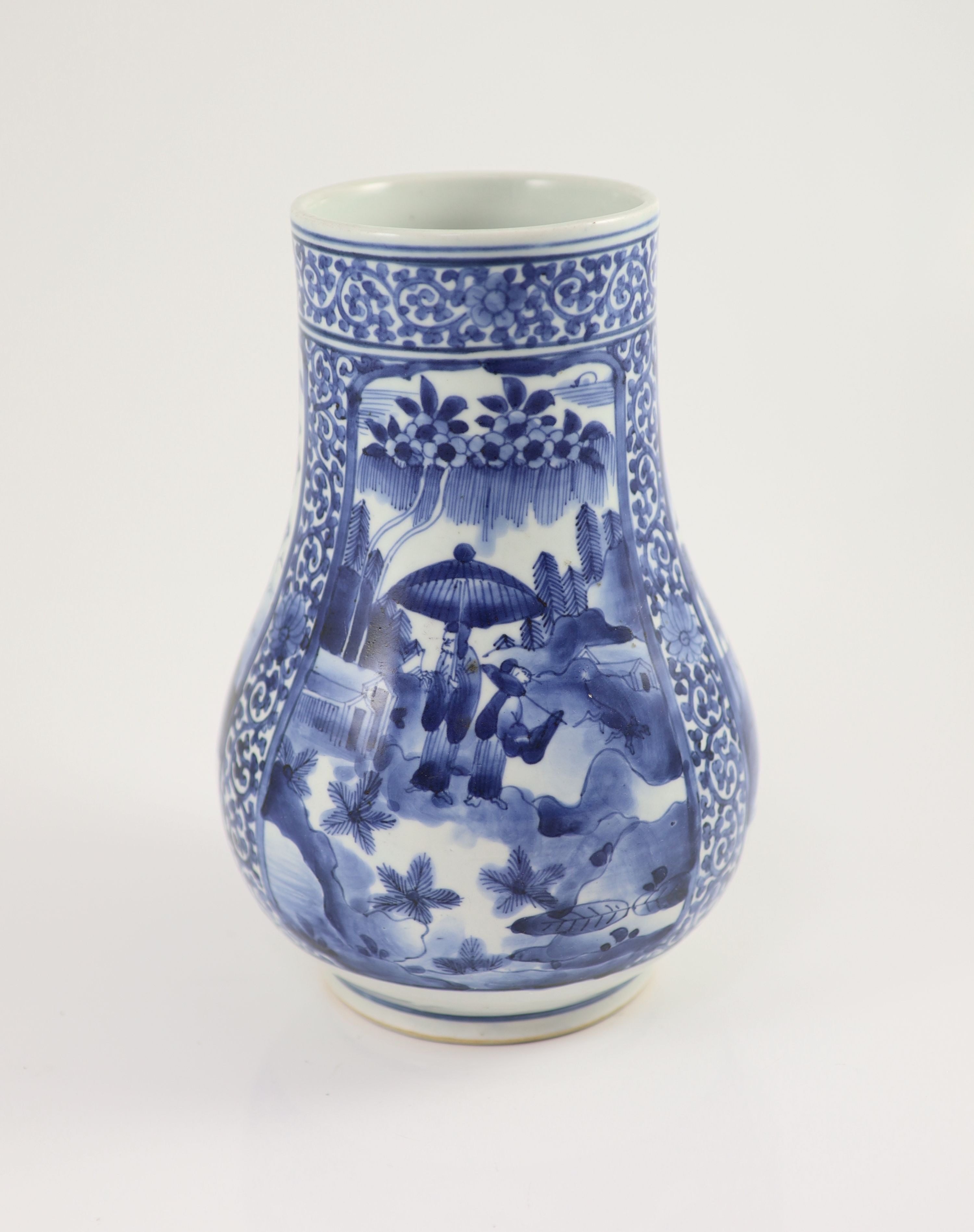 A Japanese Arita blue and white tankard, c.1700, 23.8 cm high